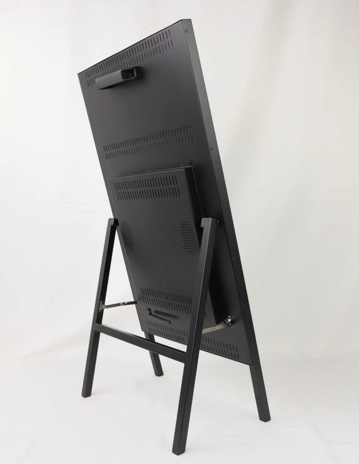 MX43 back panel showing ventilation grille, hinge mechanism and folding stand